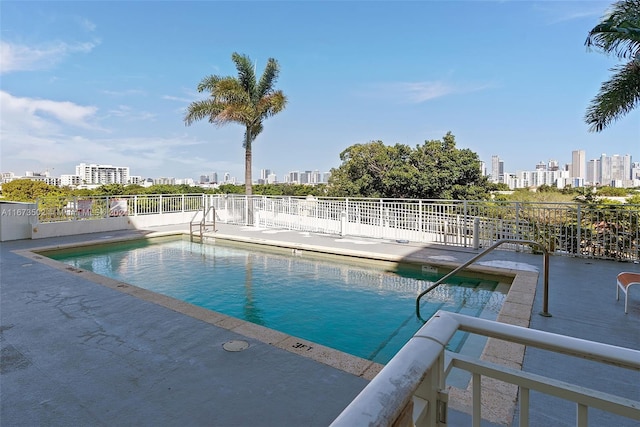 view of swimming pool with a patio