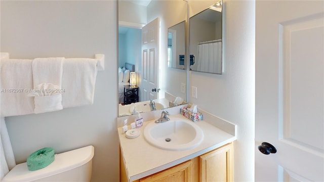 bathroom with vanity and toilet