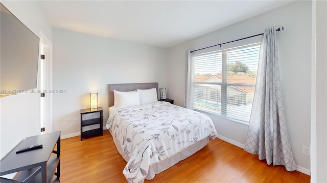 bedroom featuring wood-type flooring