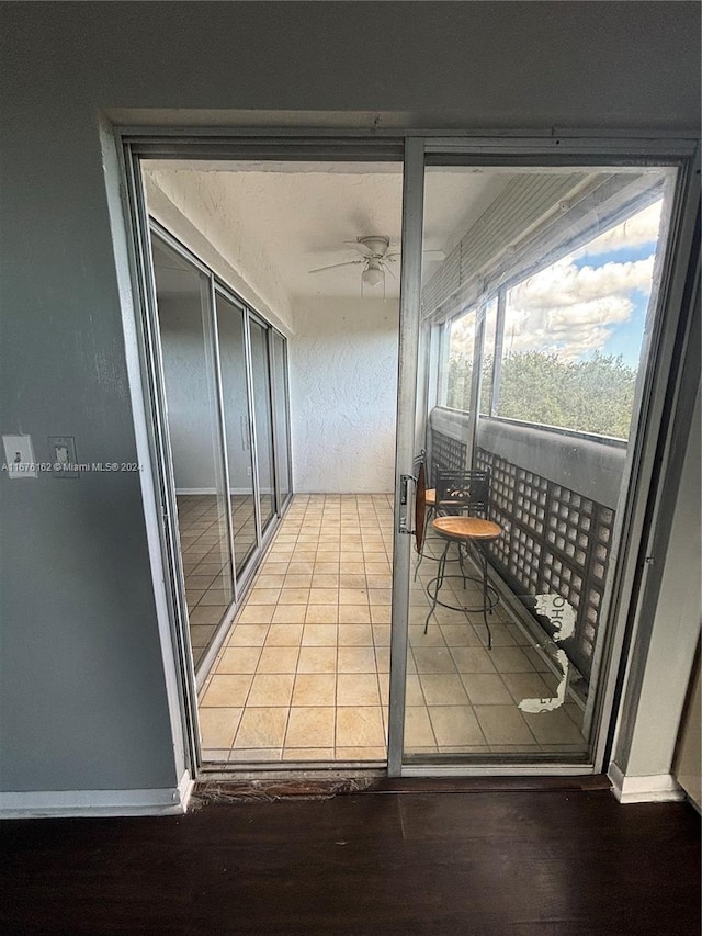 balcony featuring ceiling fan