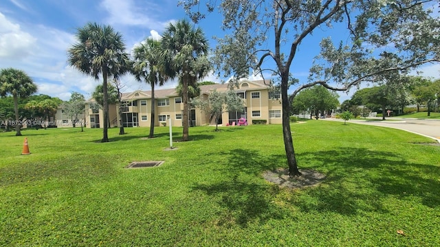 view of home's community featuring a lawn