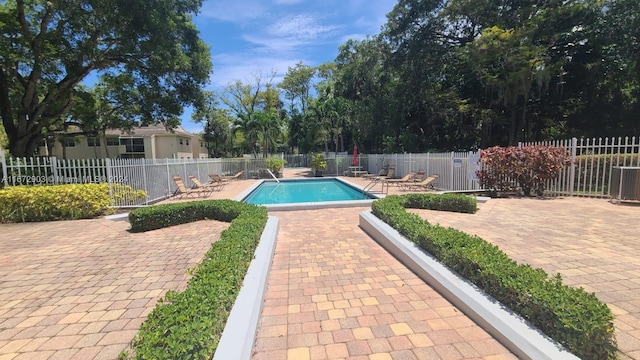 view of swimming pool with a patio area and central AC