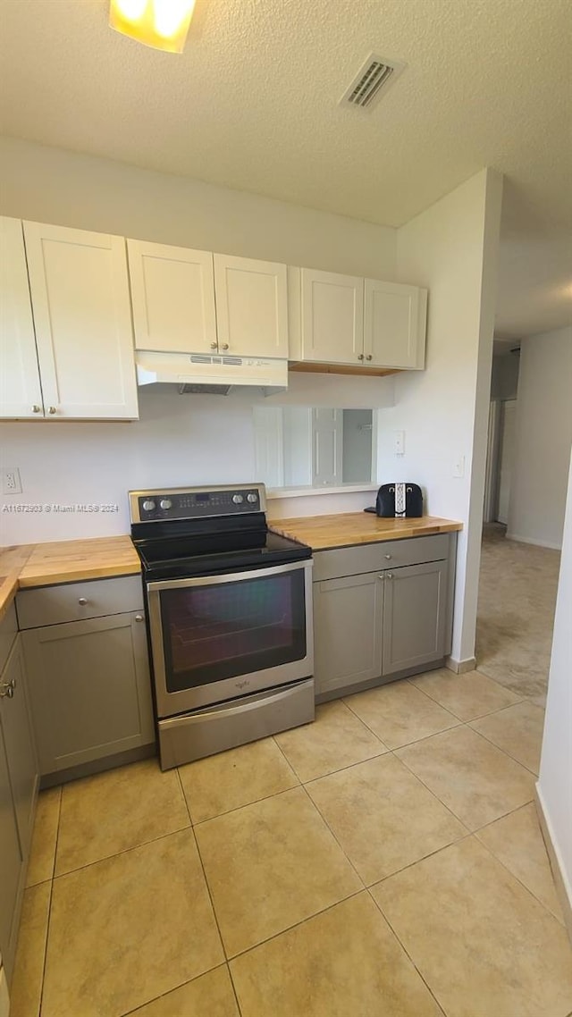 kitchen with white cabinetry, gray cabinets, a textured ceiling, and stainless steel electric range