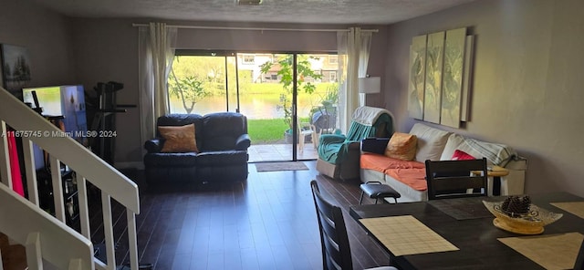 living room featuring hardwood / wood-style flooring and a textured ceiling