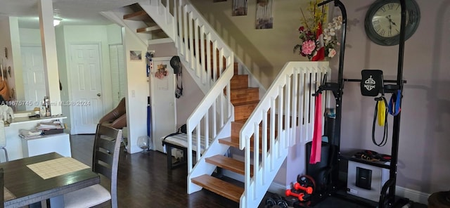 stairs with hardwood / wood-style floors