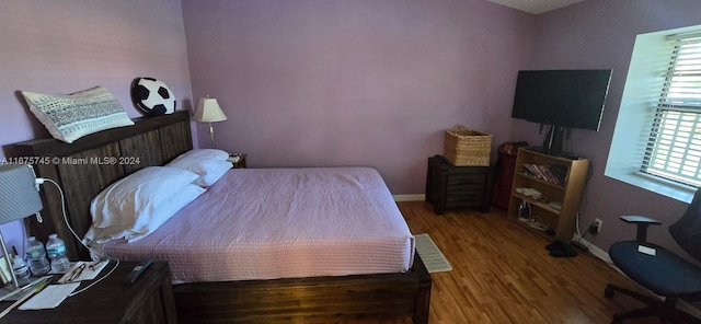 bedroom featuring wood-type flooring