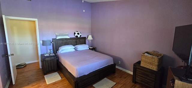 bedroom featuring hardwood / wood-style flooring