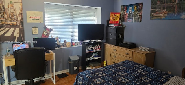 bedroom featuring wood-type flooring