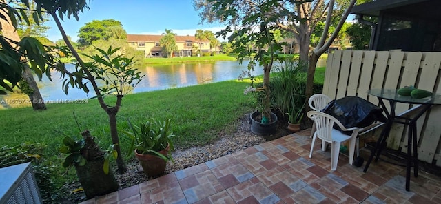 exterior space featuring a water view and a patio