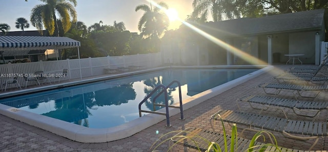 view of swimming pool with a patio area