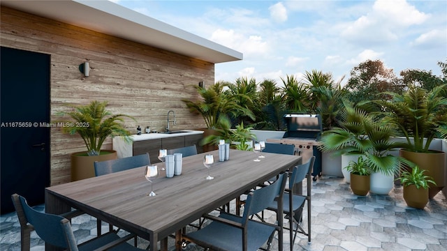 view of patio / terrace with outdoor dining space and a sink