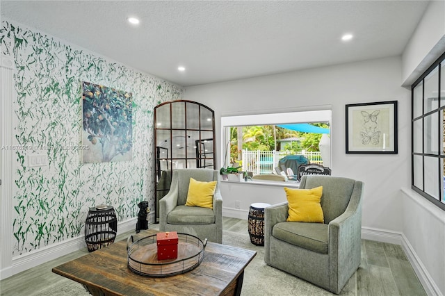 sitting room featuring hardwood / wood-style floors