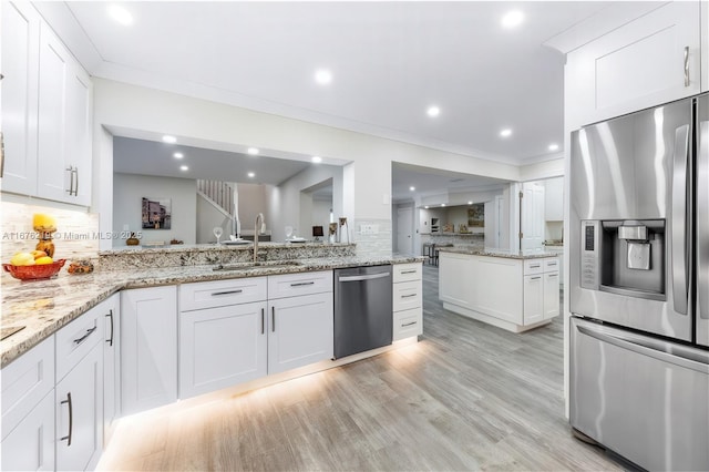 kitchen with white cabinetry and appliances with stainless steel finishes