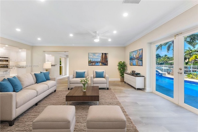 living room featuring ornamental molding, ceiling fan, light hardwood / wood-style floors, and french doors