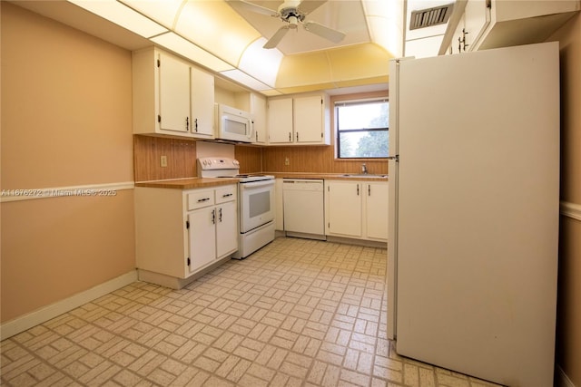 kitchen with ceiling fan, sink, white cabinets, and white appliances