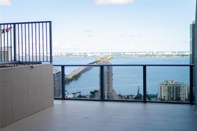 balcony featuring a water view