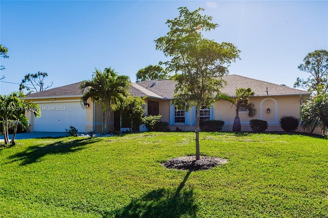 single story home featuring a garage and a front lawn