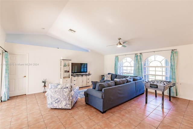 tiled living room featuring lofted ceiling and ceiling fan