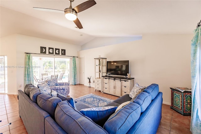 tiled living room featuring ceiling fan and lofted ceiling