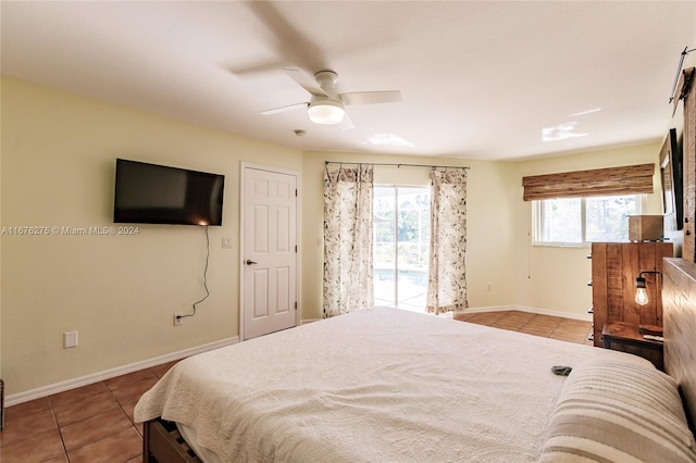 bedroom featuring tile patterned flooring, access to exterior, and ceiling fan