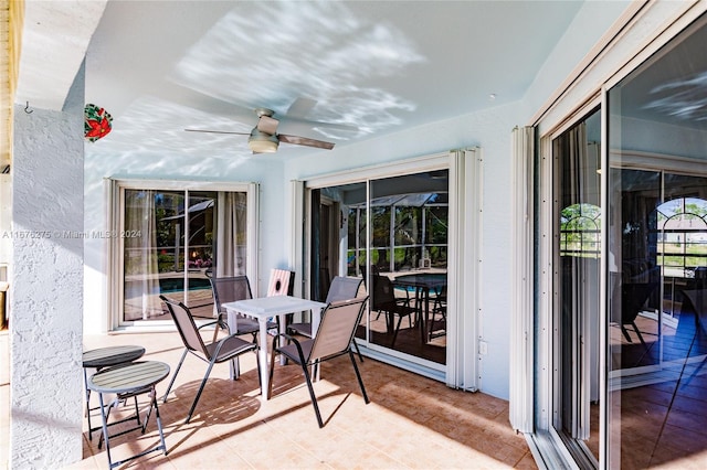 view of patio / terrace featuring ceiling fan