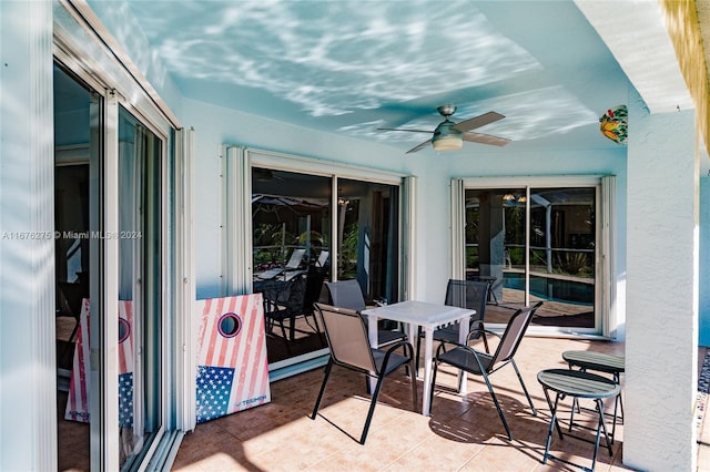 view of patio featuring ceiling fan