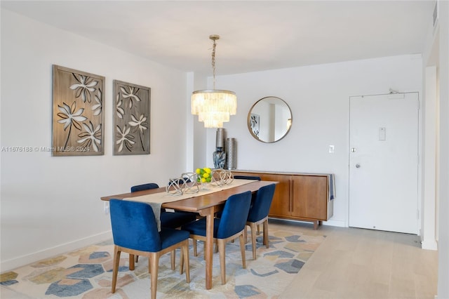 dining space featuring an inviting chandelier