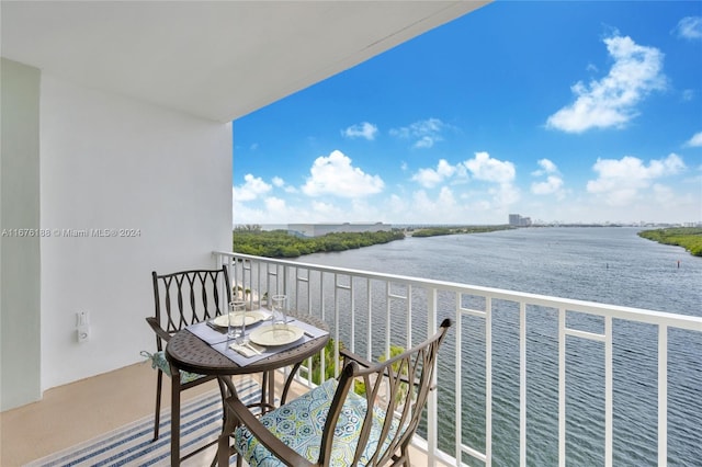 balcony featuring a water view