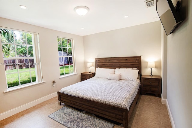 bedroom featuring recessed lighting, light tile patterned floors, visible vents, and baseboards