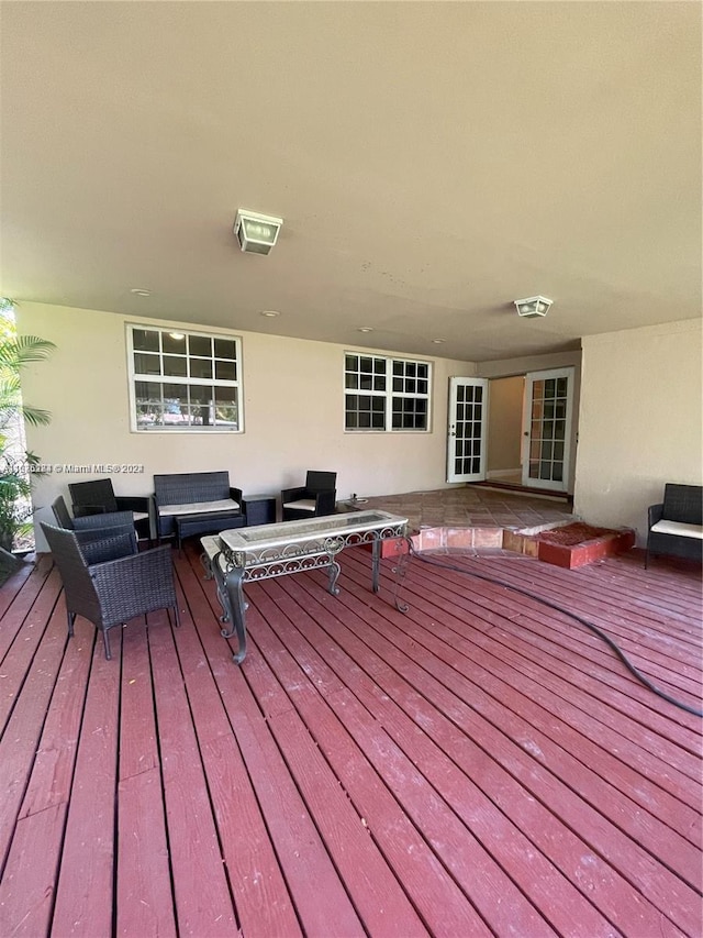 wooden terrace featuring an outdoor hangout area