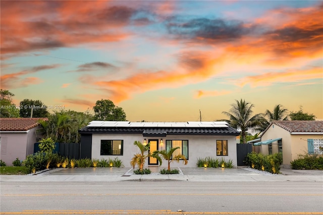 view of front of house with solar panels