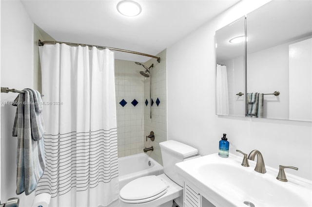 full bathroom featuring shower / bath combination with curtain, vanity, and toilet