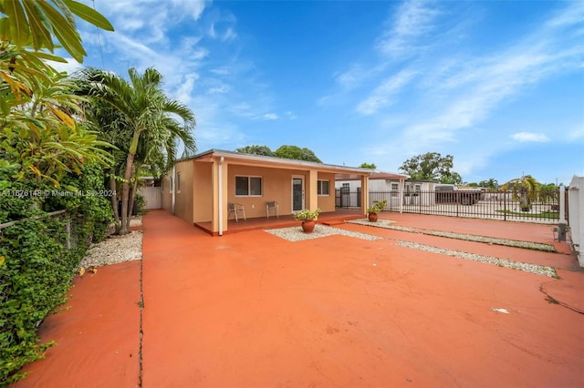 back of house with a patio