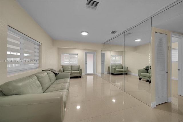 living room with tile patterned floors