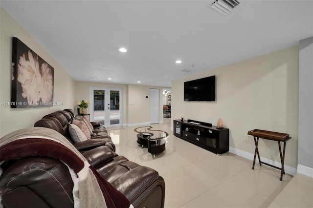 living room with french doors and light tile patterned flooring