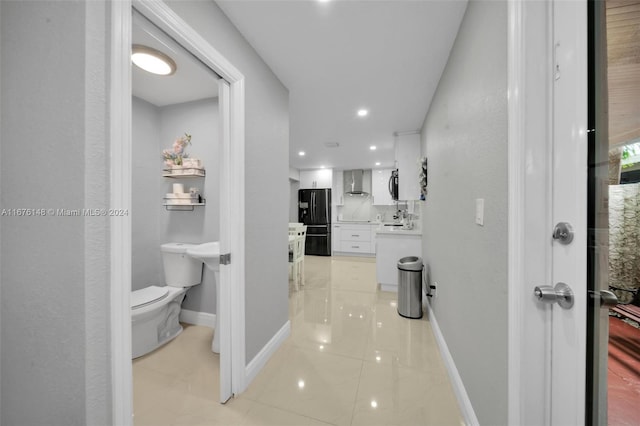 corridor featuring light tile patterned flooring