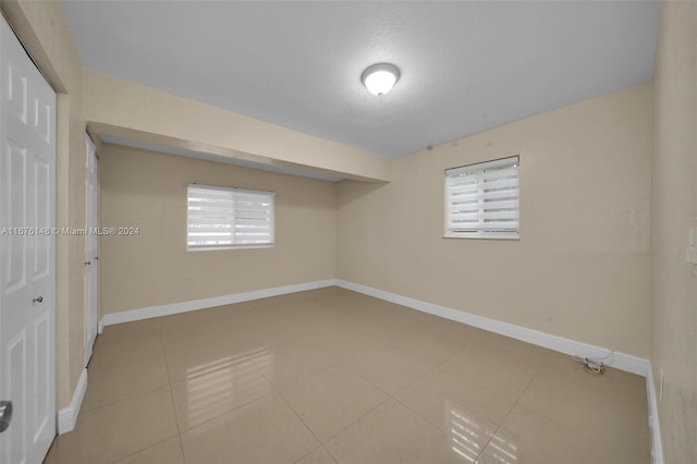 basement with light tile patterned floors