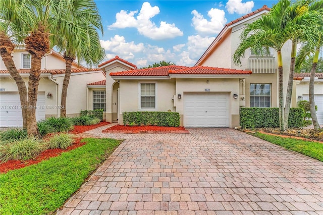 mediterranean / spanish-style house featuring a garage