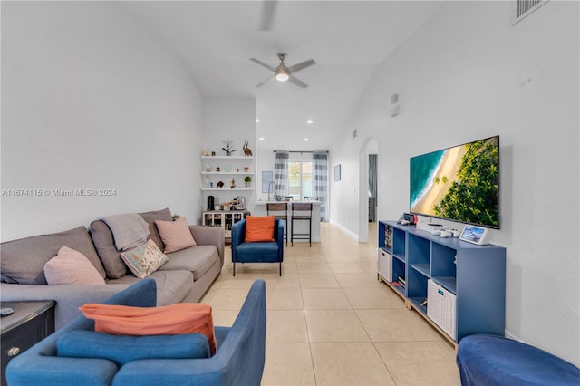 tiled living room featuring lofted ceiling and ceiling fan