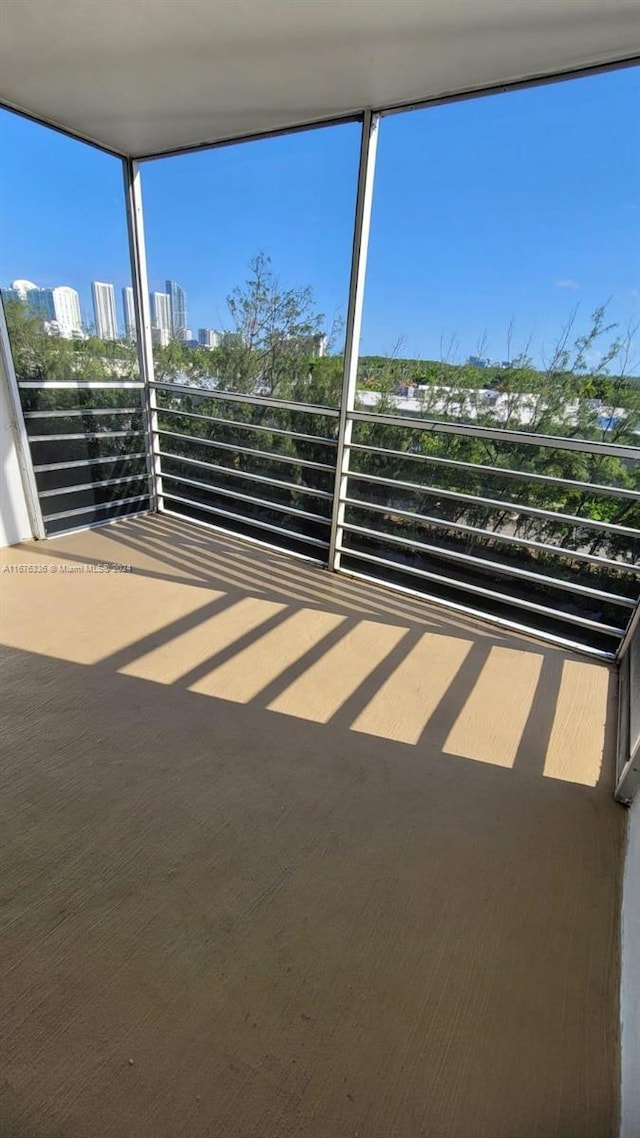 view of patio featuring a balcony and a city view