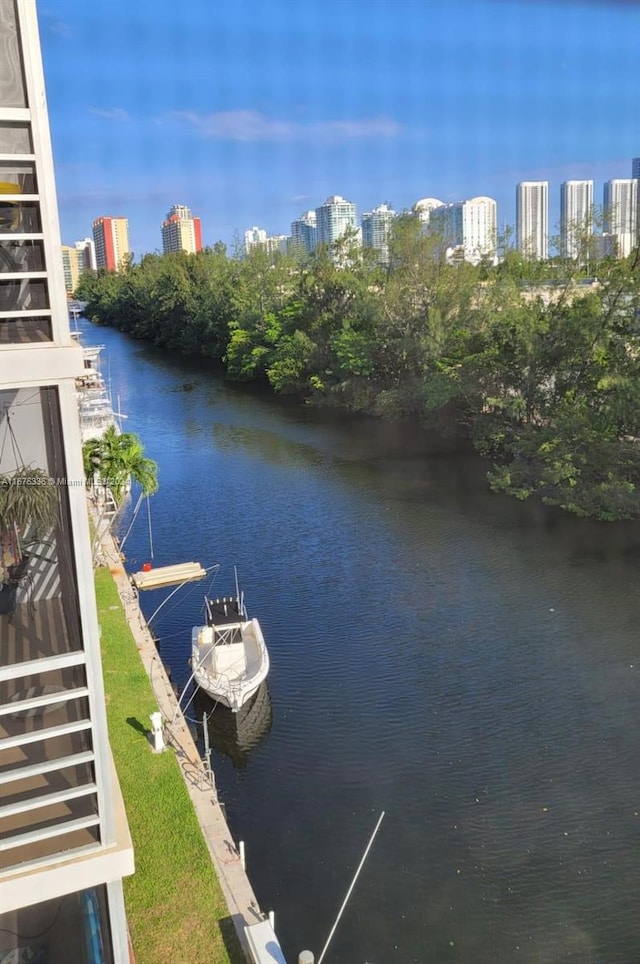 property view of water featuring a view of city and a dock