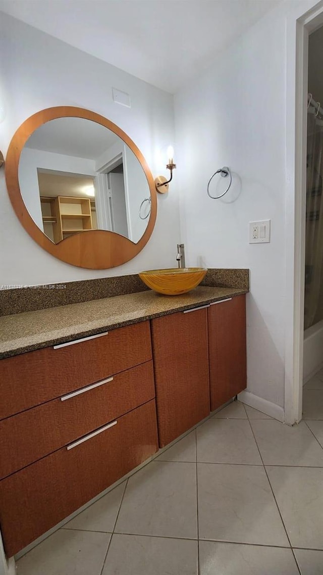 bathroom featuring tile patterned floors and vanity