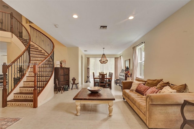 living room with an inviting chandelier