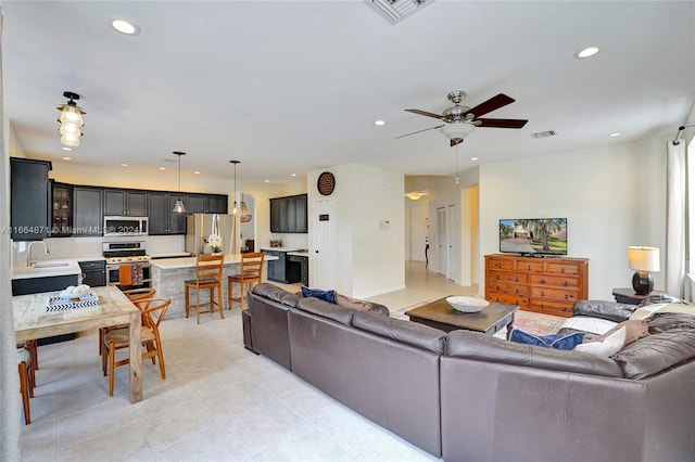 living room with sink and ceiling fan