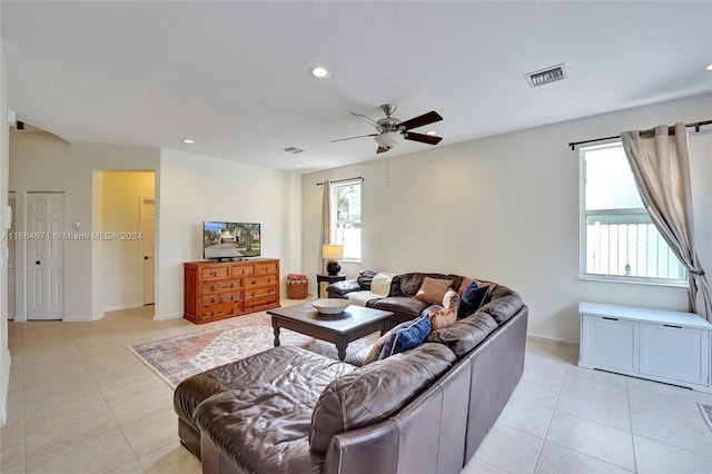 tiled living room featuring ceiling fan