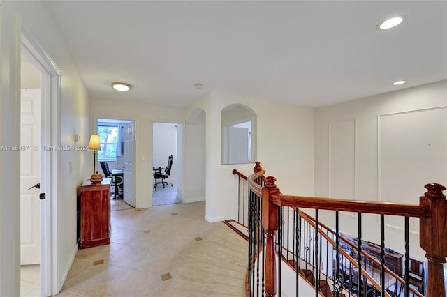 hall with light tile patterned flooring