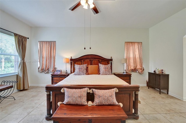 tiled bedroom with ceiling fan