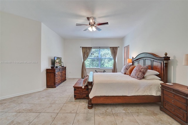 tiled bedroom with ceiling fan