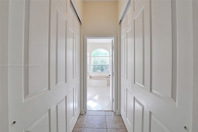 hallway with light tile patterned floors