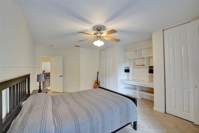 tiled bedroom featuring ceiling fan